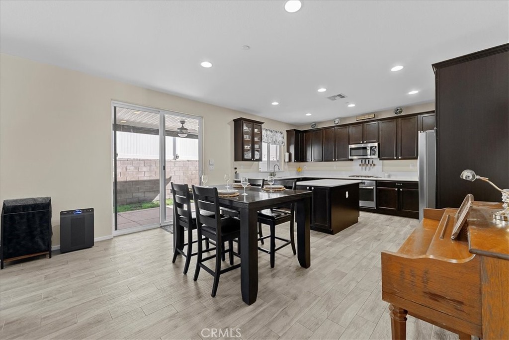 10969 Elkwood Circle Riverside, CA 92503 - Photo 6 of 42 a kitchen with a table and chairs in it