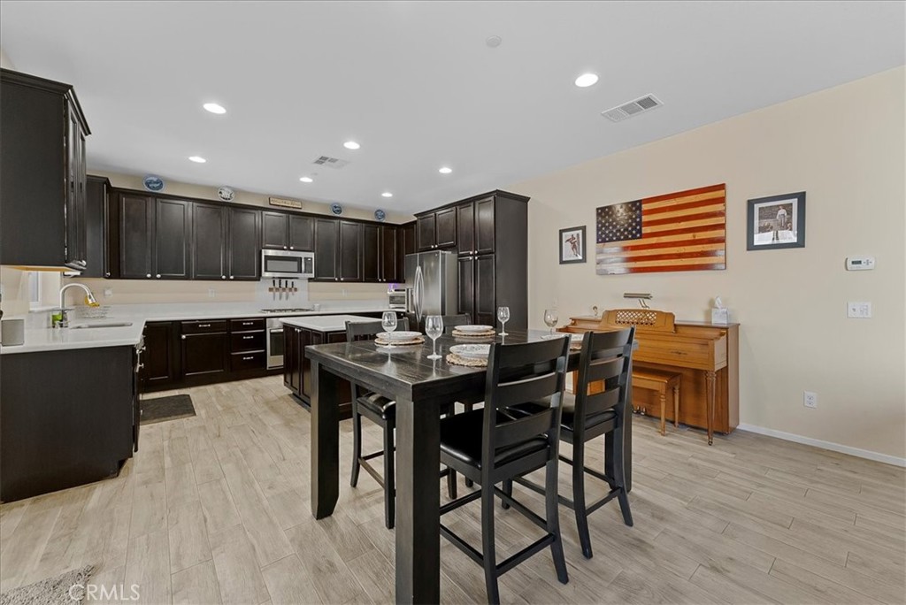 10969 Elkwood Circle Riverside, CA 92503 - Photo 7 of 42 a kitchen with a table and chairs in it