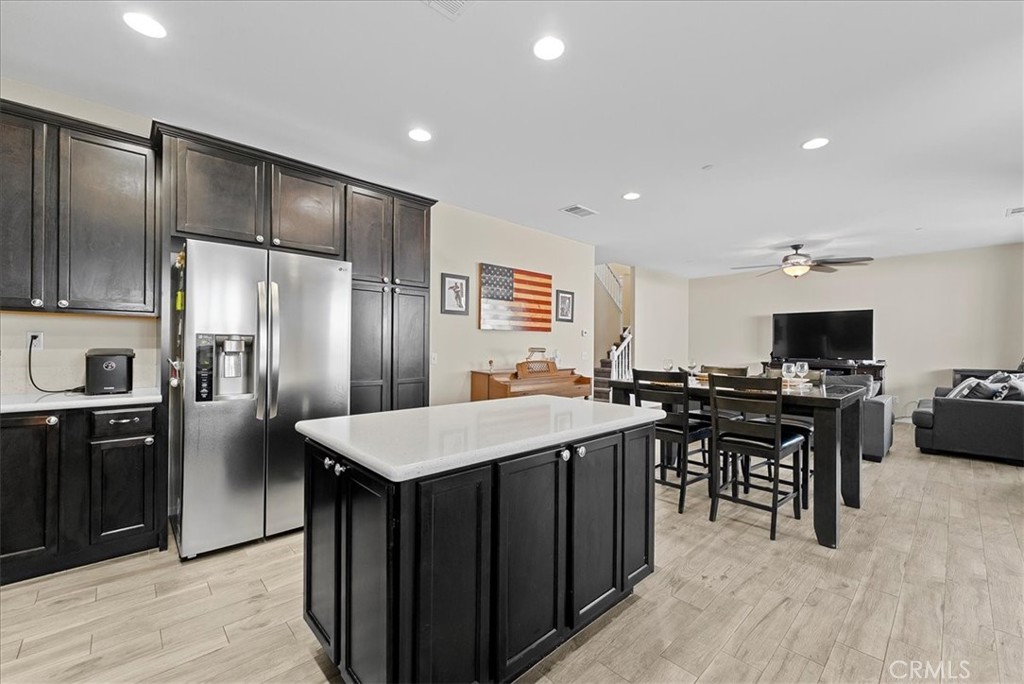 10969 Elkwood Circle Riverside, CA 92503 - Photo 9 of 42 a large kitchen with a large counter top space and stainless steel appliances