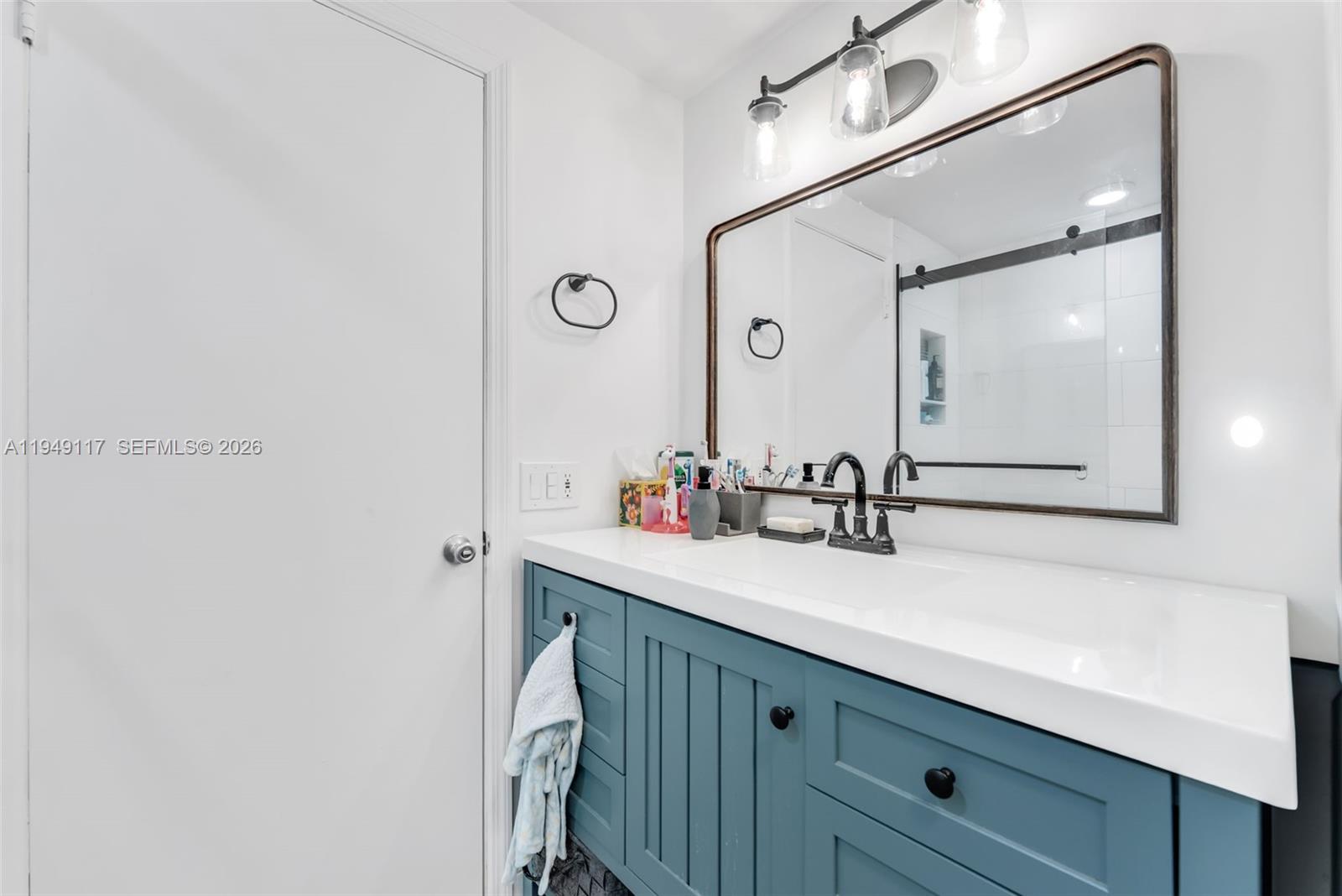 7858 Southwest 102nd Lane Miami, FL 33156 - Photo 11 of 22 a bathroom with a sink and a mirror