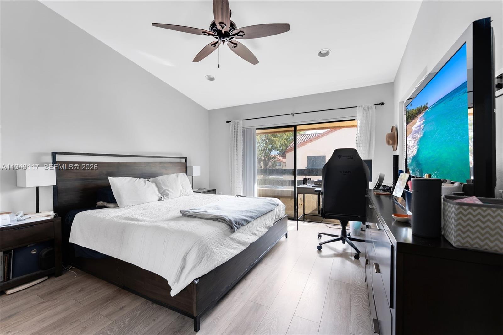 7858 Southwest 102nd Lane Miami, FL 33156 - Photo 12 of 22 a bed room with a bed and a chair