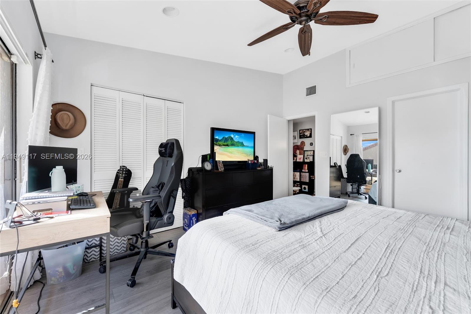 7858 Southwest 102nd Lane Miami, FL 33156 - Photo 13 of 22 a bed room with a bed and a chair