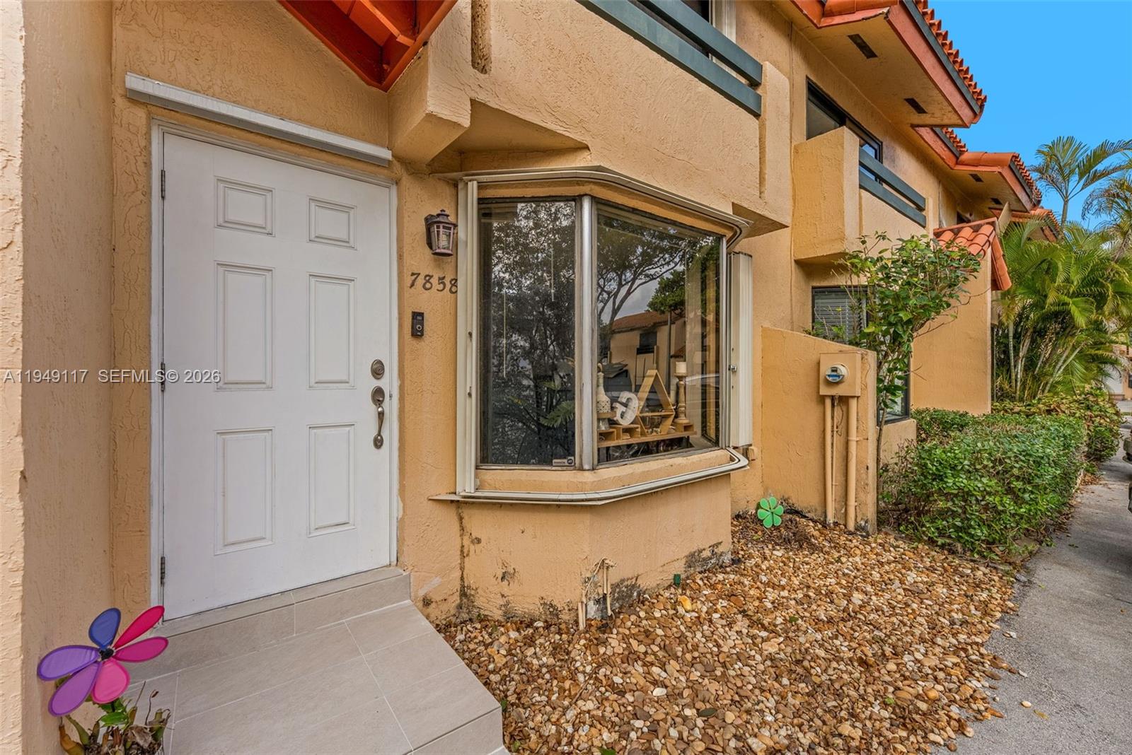 7858 Southwest 102nd Lane Miami, FL 33156 - Photo 3 of 22 a front view of a house