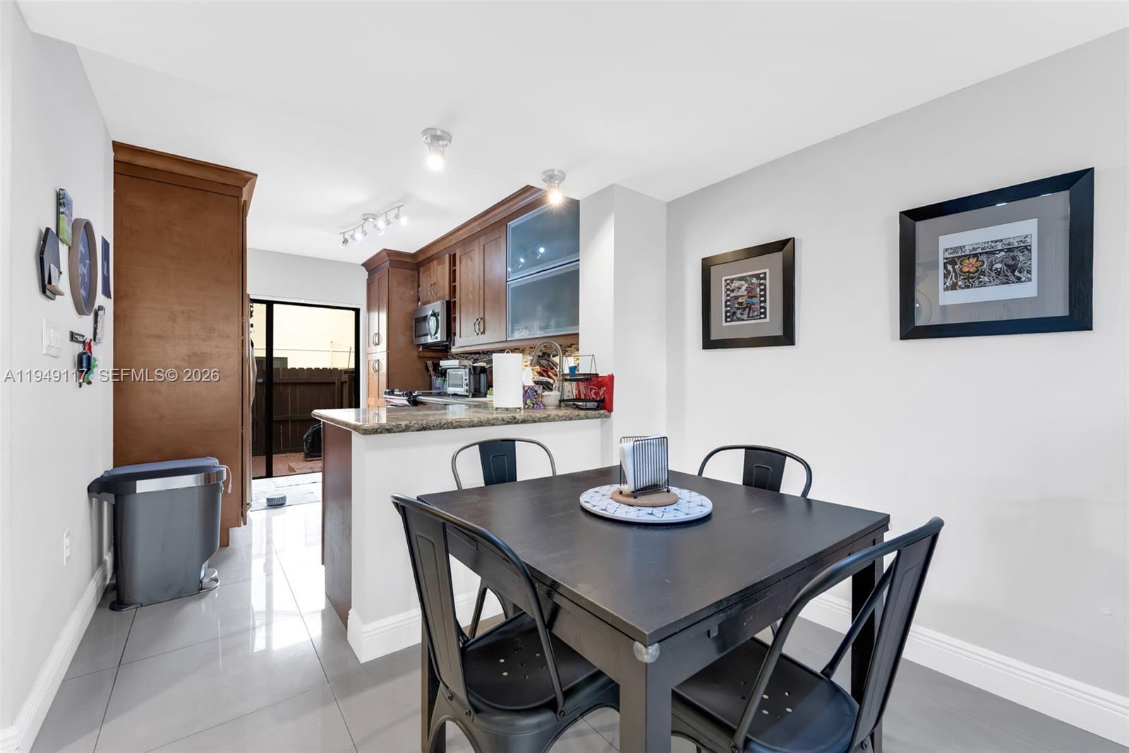 7858 Southwest 102nd Lane Miami, FL 33156 - Photo 8 of 22 a dining room with furniture and window