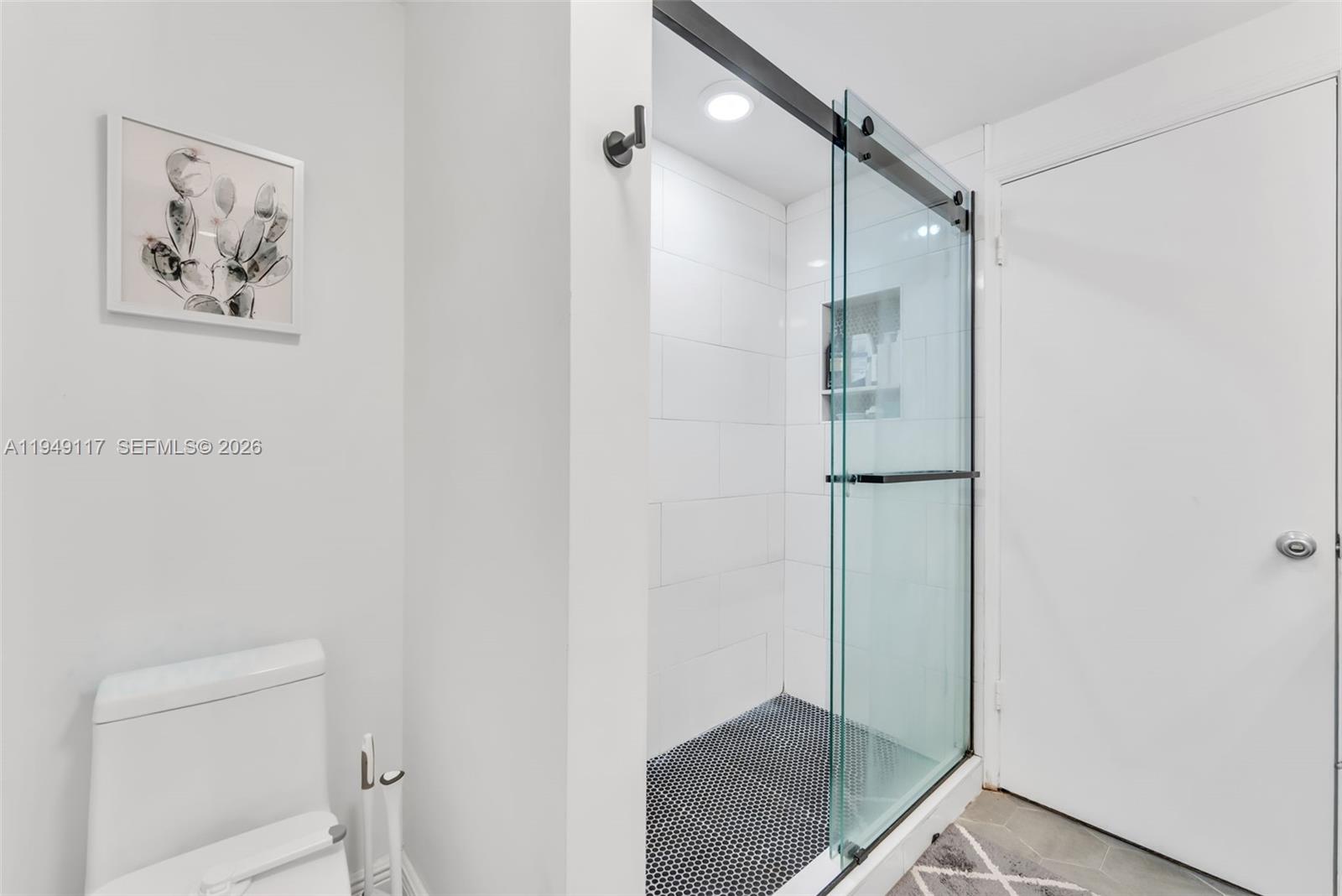 7858 Southwest 102nd Lane Miami, FL 33156 - Photo 9 of 22 a bathroom with a shower and a toilet