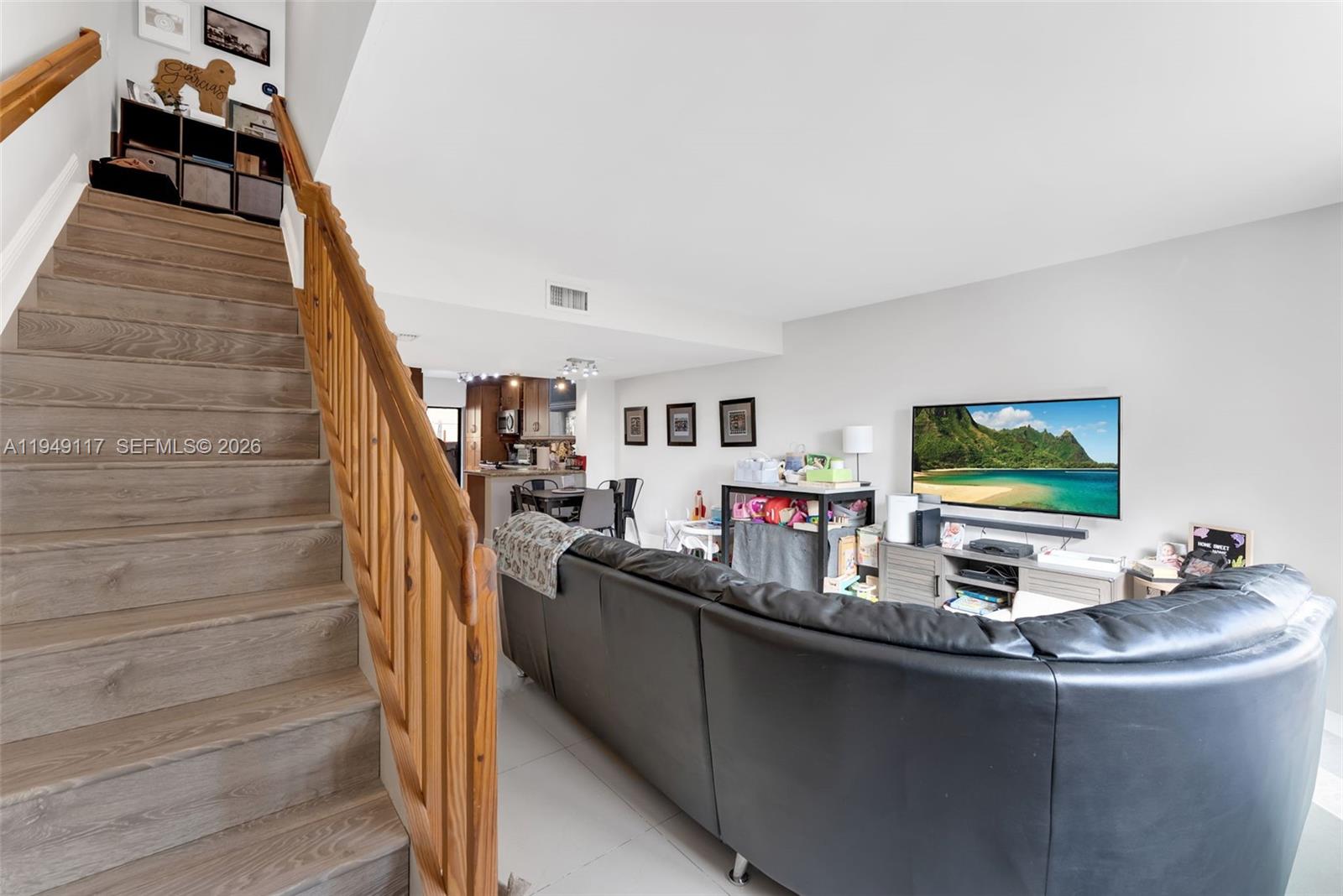 7858 Southwest 102nd Lane Miami, FL 33156 - Photo 10 of 22 a living room with furniture and flat screen tv