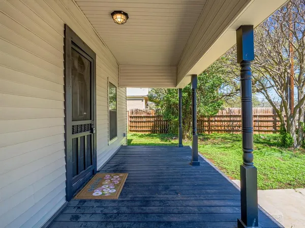 a view of a porch with wooden floor and outdoor space
