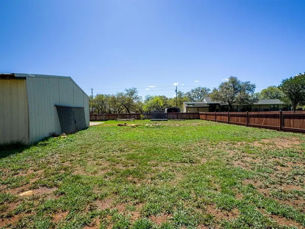 a view of a backyard with a garden