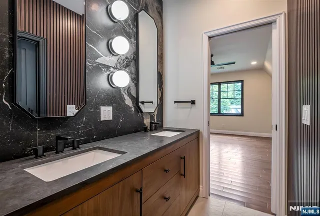 a bathroom with a sink and a mirror