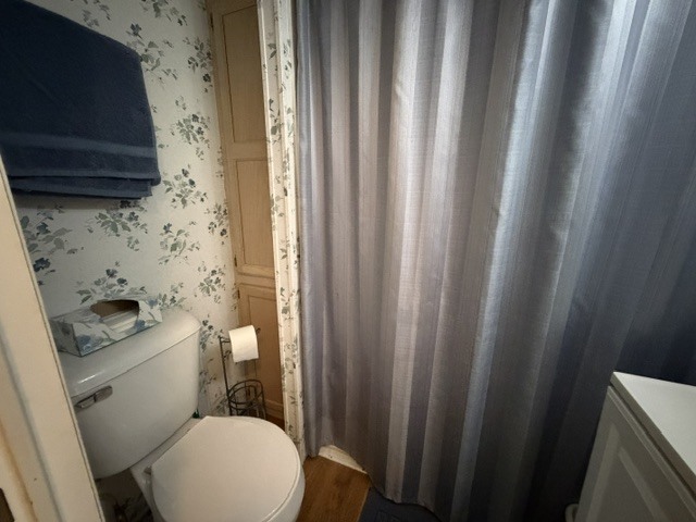 2795 East 28th Road Marseilles, IL 61341 - Photo 25 of 91 a bathroom with a toilet and a shower curtain