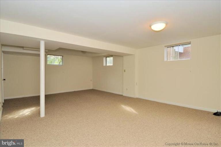 602 Lanark Way Silver Spring, MD 20901 - Photo 15 of 24 an empty room with a empty space and windows