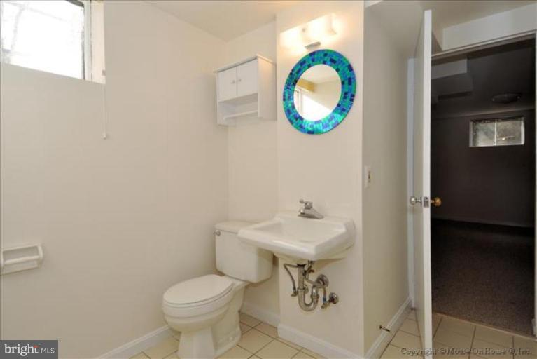 602 Lanark Way Silver Spring, MD 20901 - Photo 18 of 24 a bathroom with a toilet and a sink