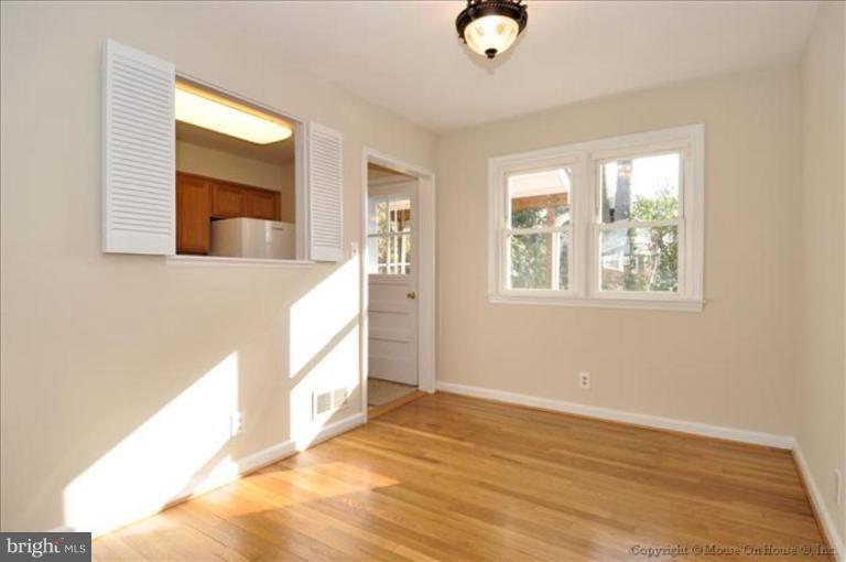 602 Lanark Way Silver Spring, MD 20901 - Photo 5 of 24 a view of an empty room and window