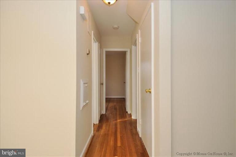602 Lanark Way Silver Spring, MD 20901 - Photo 8 of 24 a view of a hallway with wooden floor