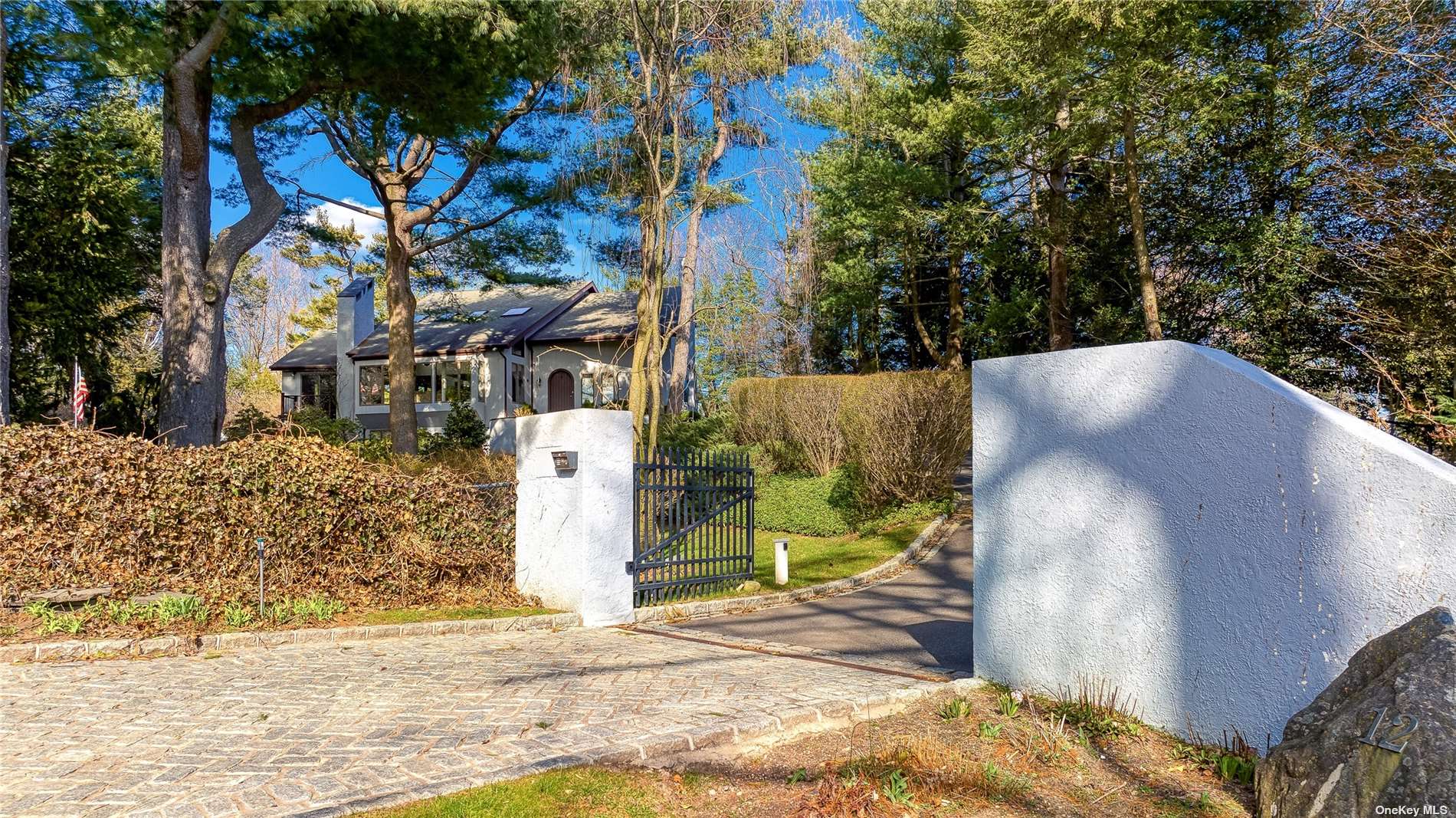 12 Cedar Lane Sands Point, NY 11050 - Photo 1 of 1 a view of a house with a yard