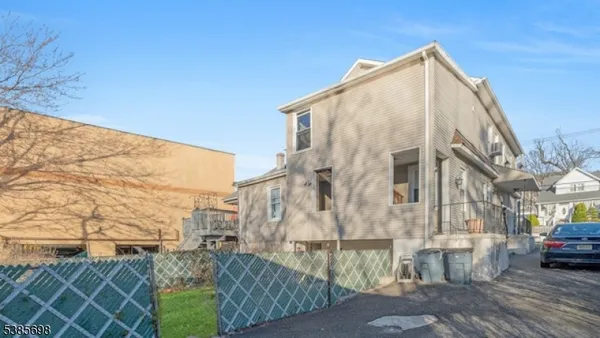 a view of a street with a building in the background