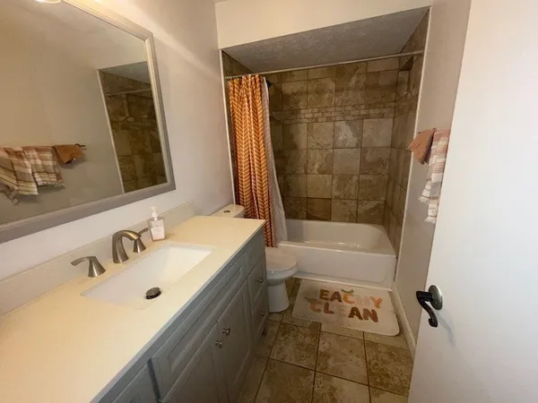 a bathroom with a bathtub and a sink