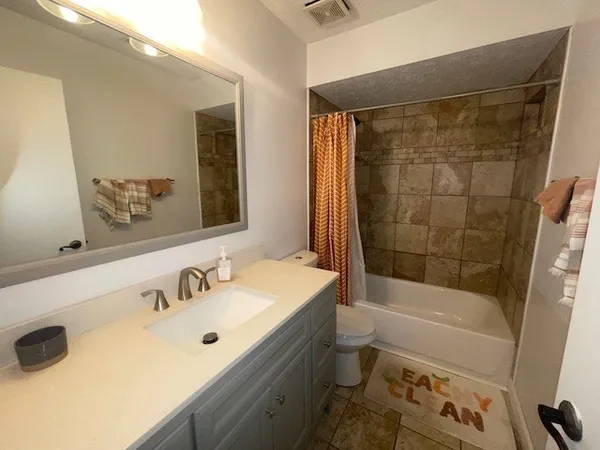 a bathroom with a sink and a bathtub