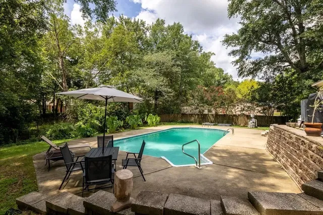 an outdoor space with furniture and umbrella