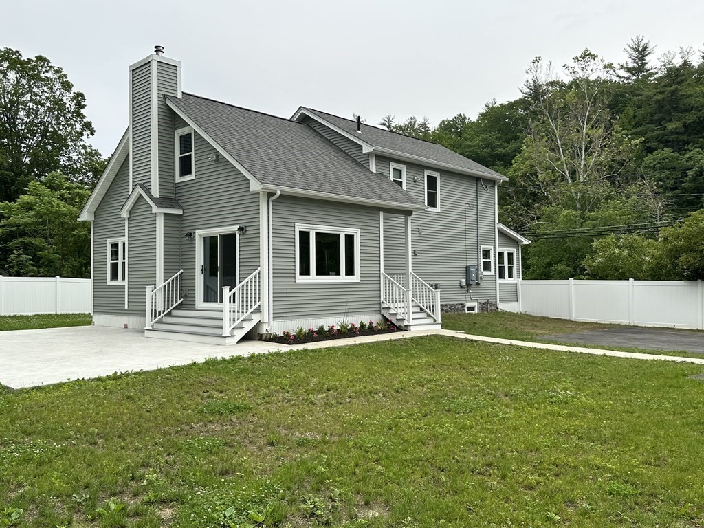 26 Worthington Road Huntington, MA 01050 - Photo 1 of 25 a front view of a house with a yard