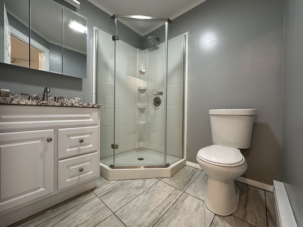26 Worthington Road Huntington, MA 01050 - Photo 17 of 25 a bathroom with a toilet sink and shower