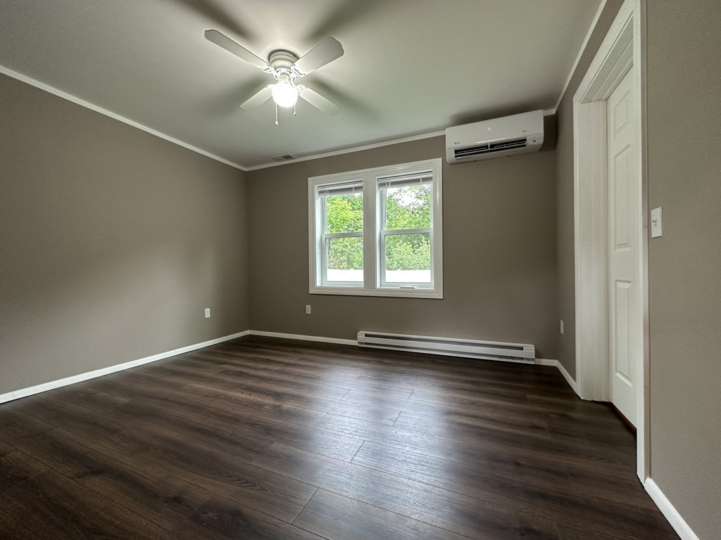 26 Worthington Road Huntington, MA 01050 - Photo 18 of 25 an empty room with wooden floor and windows