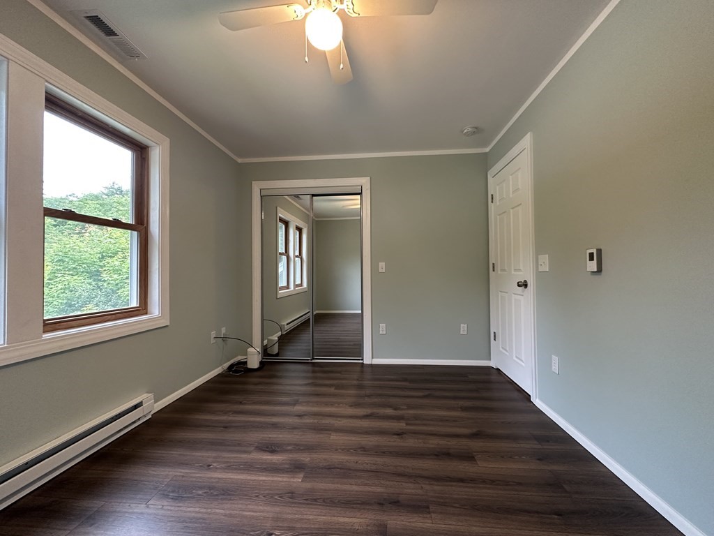 26 Worthington Road Huntington, MA 01050 - Photo 23 of 25 a view of an empty room with wooden floor and a window