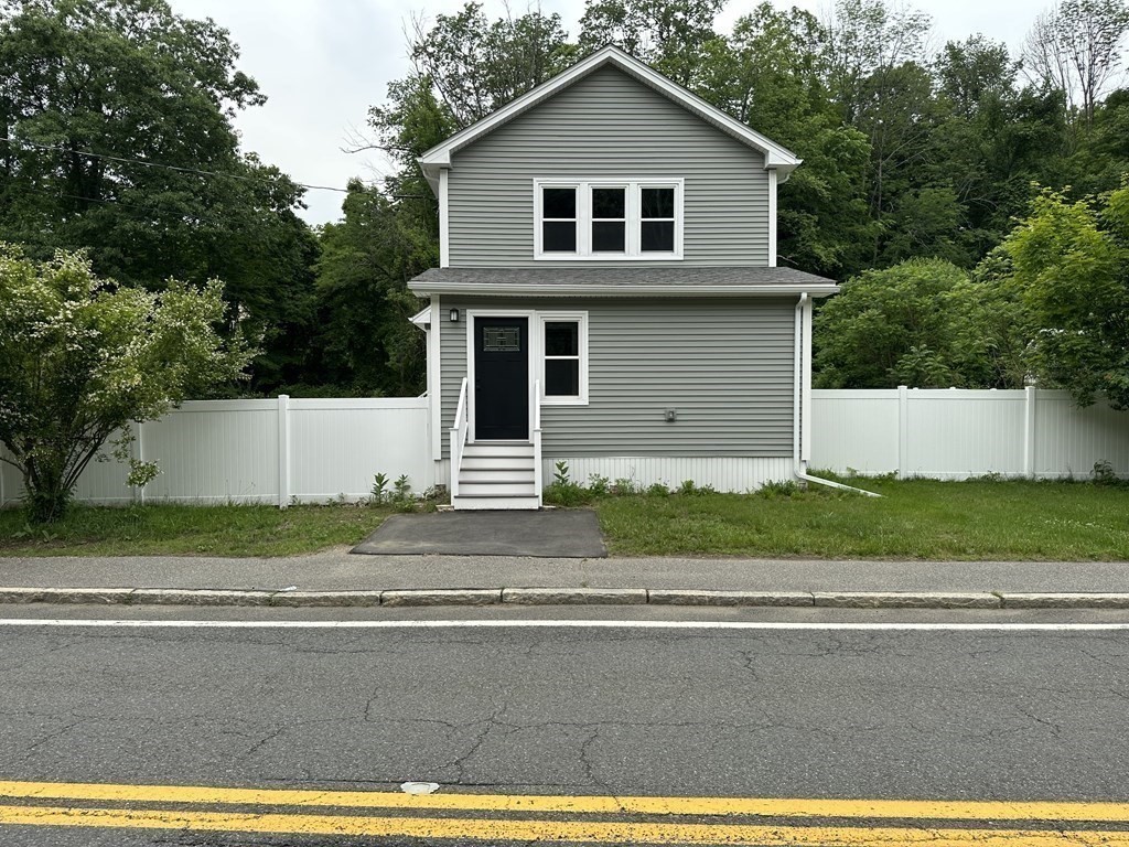 26 Worthington Road Huntington, MA 01050 - Photo 4 of 25 a front view of a house with a yard and garage