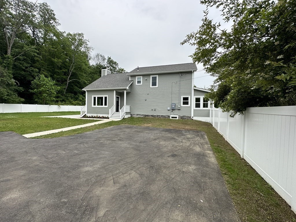 26 Worthington Road Huntington, MA 01050 - Photo 7 of 25 a front view of a house with a yard and trees