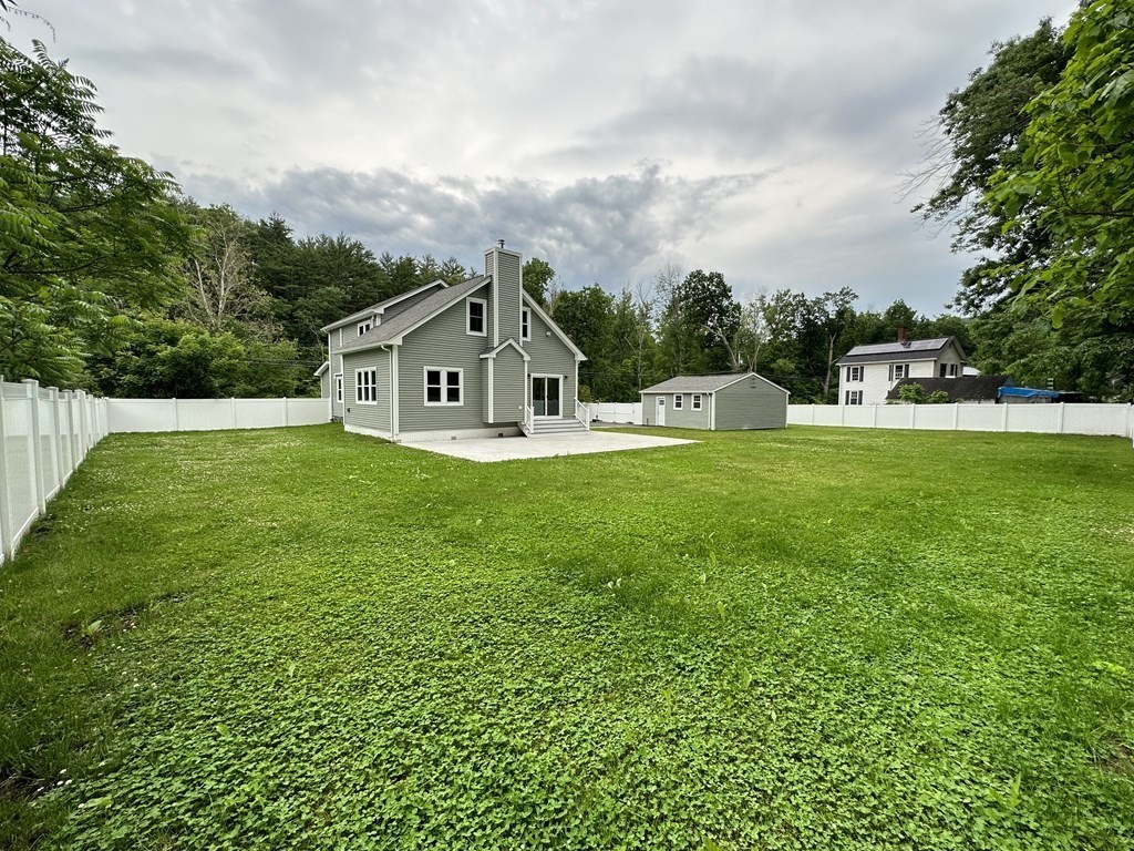 26 Worthington Road Huntington, MA 01050 - Photo 10 of 25 a view of a house with a big yard and large trees