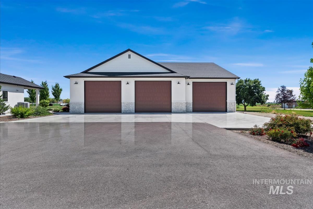 8195 Joplin Road Nampa, ID 83687 - Photo 46 of 50 Gym is two doors on left, shop is door on right. Shop has drive-thru doors.