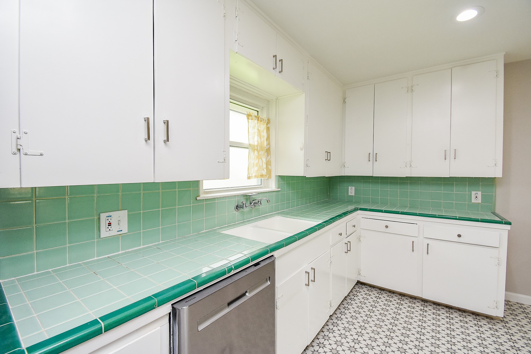 7901 Ridgeview Drive Houston, TX 77055 - Photo 14 of 37 a kitchen with a sink a counter top space and cabinets