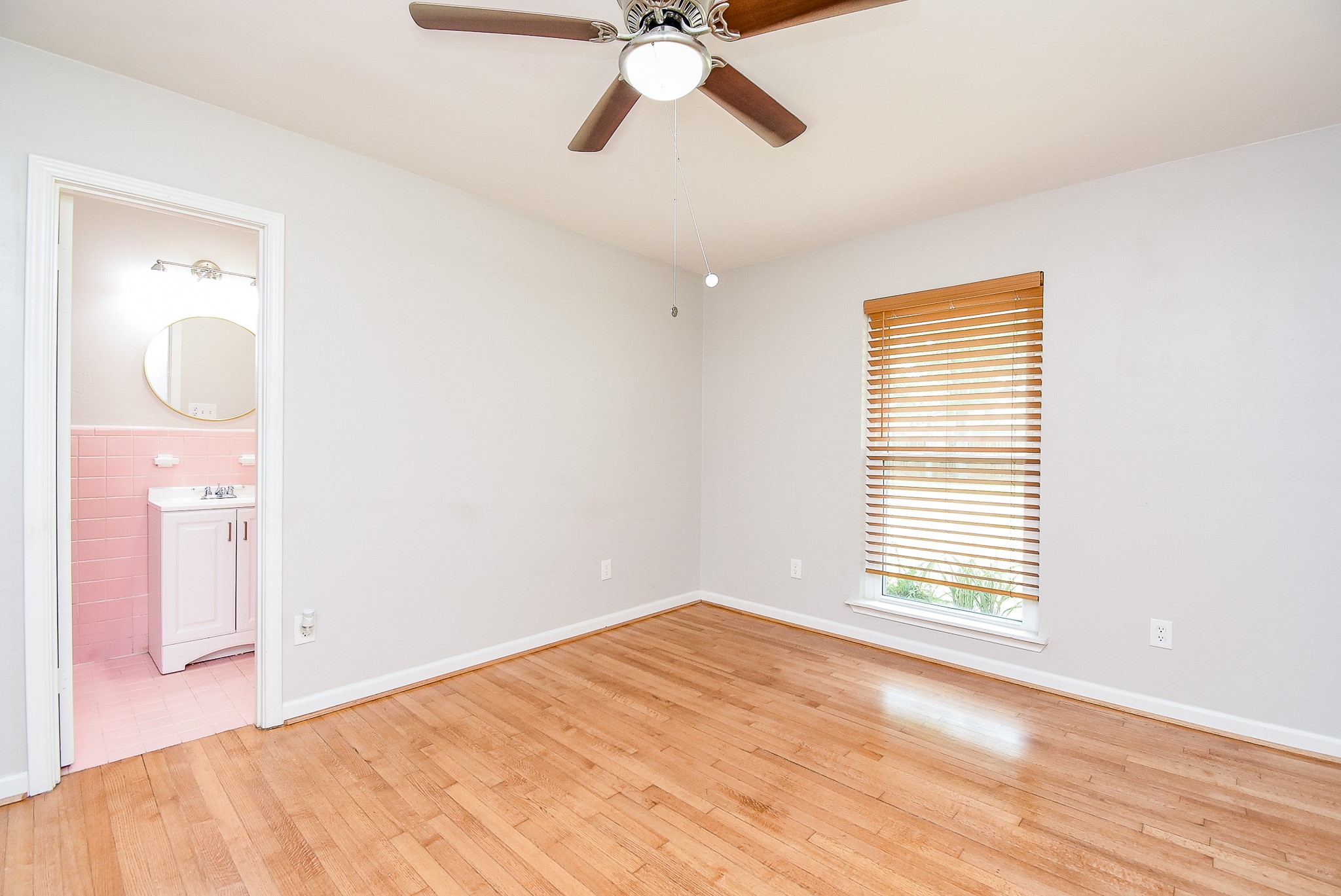 7901 Ridgeview Drive Houston, TX 77055 - Photo 17 of 37 a view of empty room with wooden floor and fan