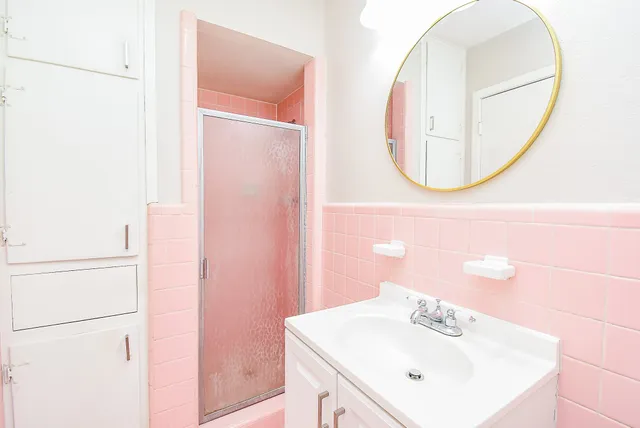 a bathroom with a sink and a mirror