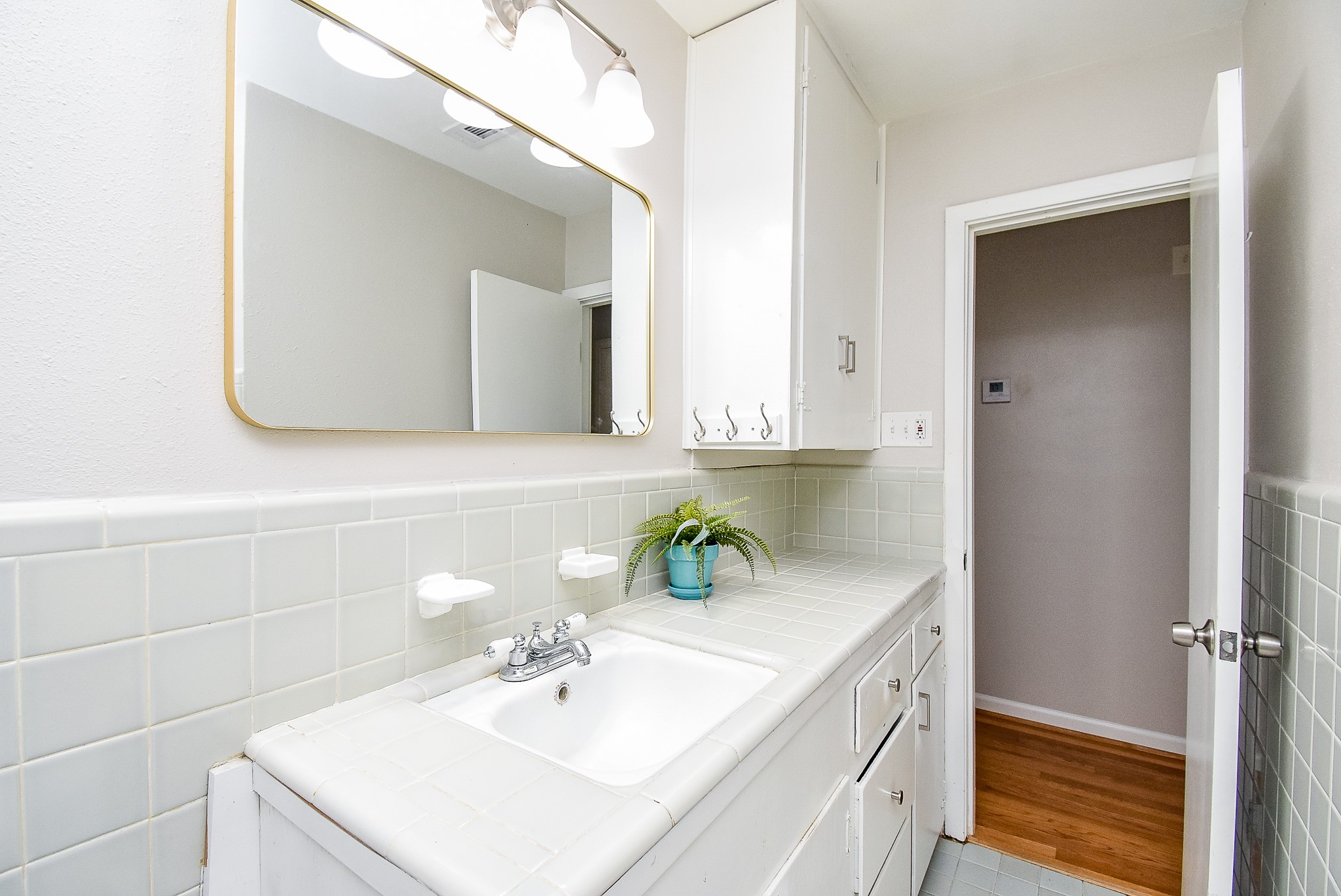 7901 Ridgeview Drive Houston, TX 77055 - Photo 24 of 37 a bathroom with a sink and a mirror