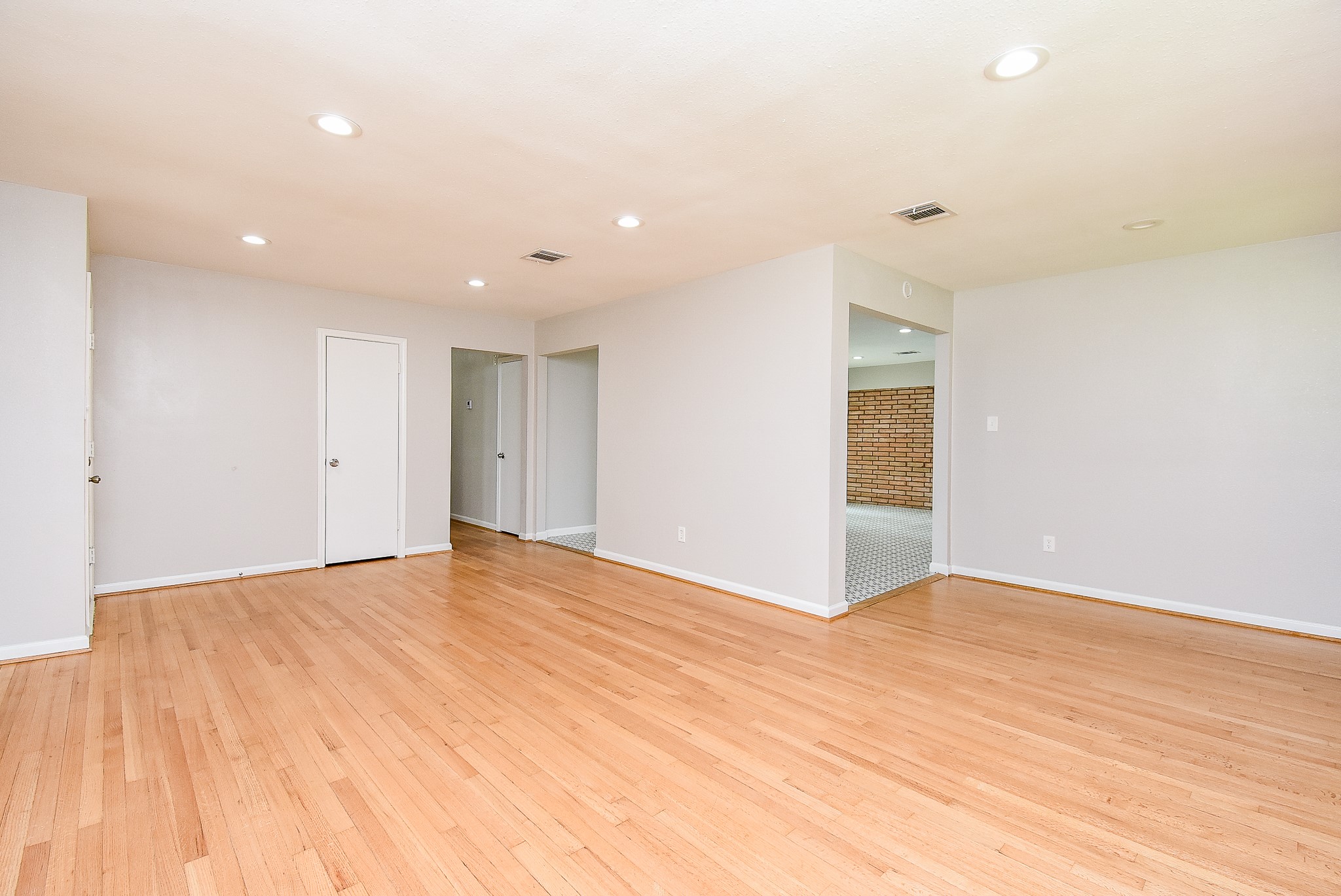 7901 Ridgeview Drive Houston, TX 77055 - Photo 4 of 37 a view of an empty room with wooden floor