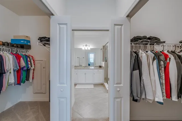 a bathroom with a granite countertop sink shower and a mirror