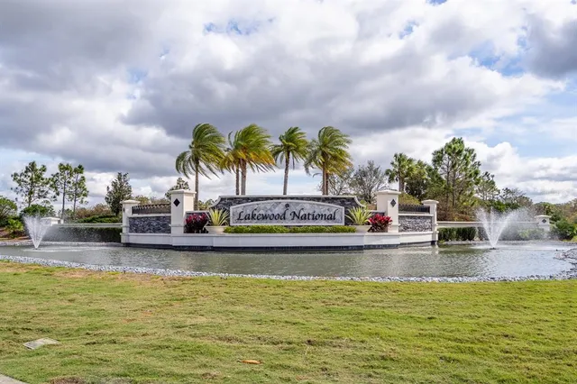 an aerial view of a house with a big yard