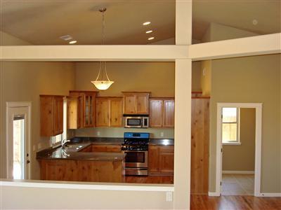 900 Win Way Eagle Point, OR 97524 - Photo 5 of 9 a kitchen with granite countertop a refrigerator and a stove