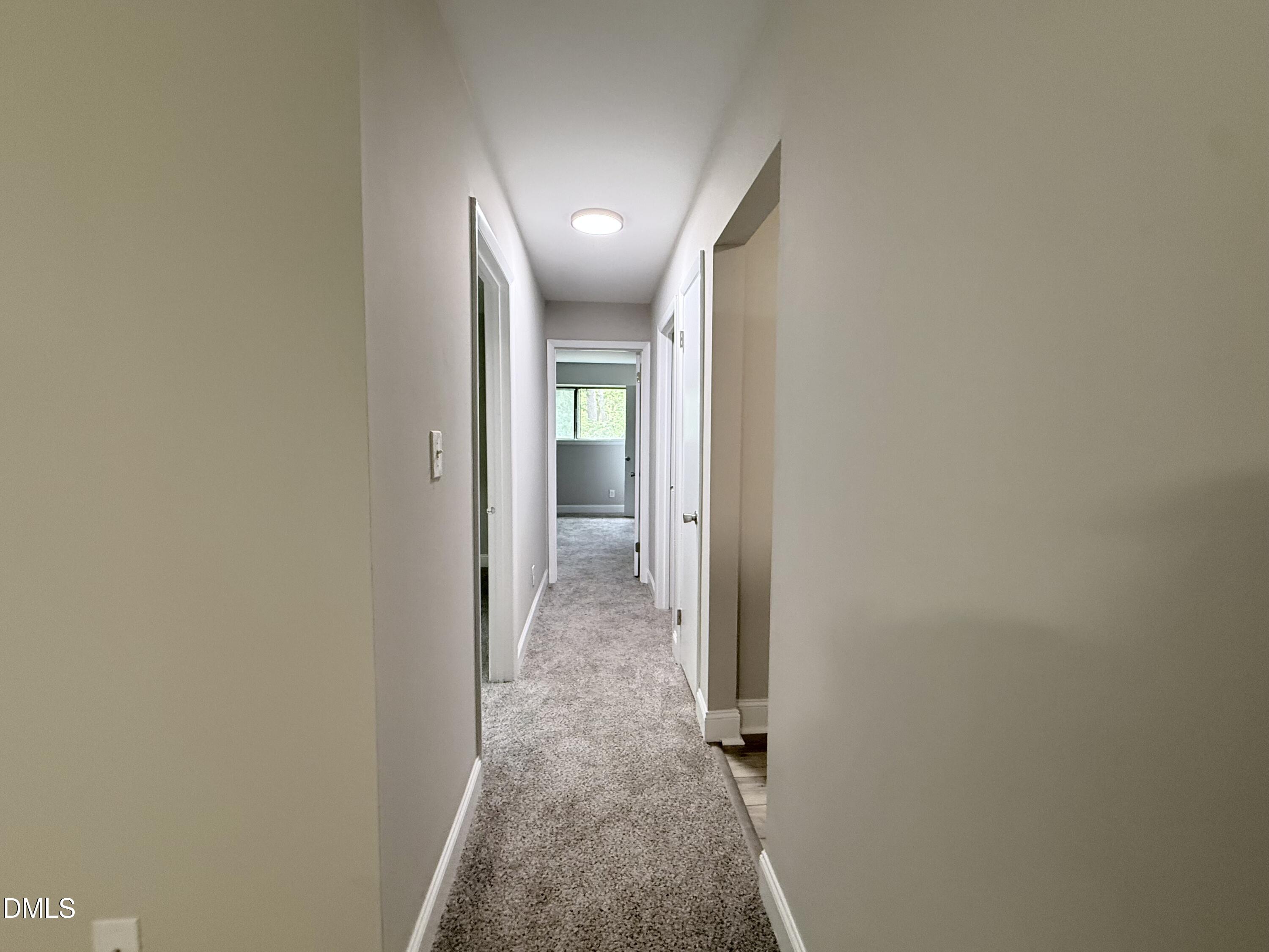 1114 Schaub Drive, Unit I Raleigh, NC 27606 - Photo 6 of 9 a view of a hallway with wooden floor