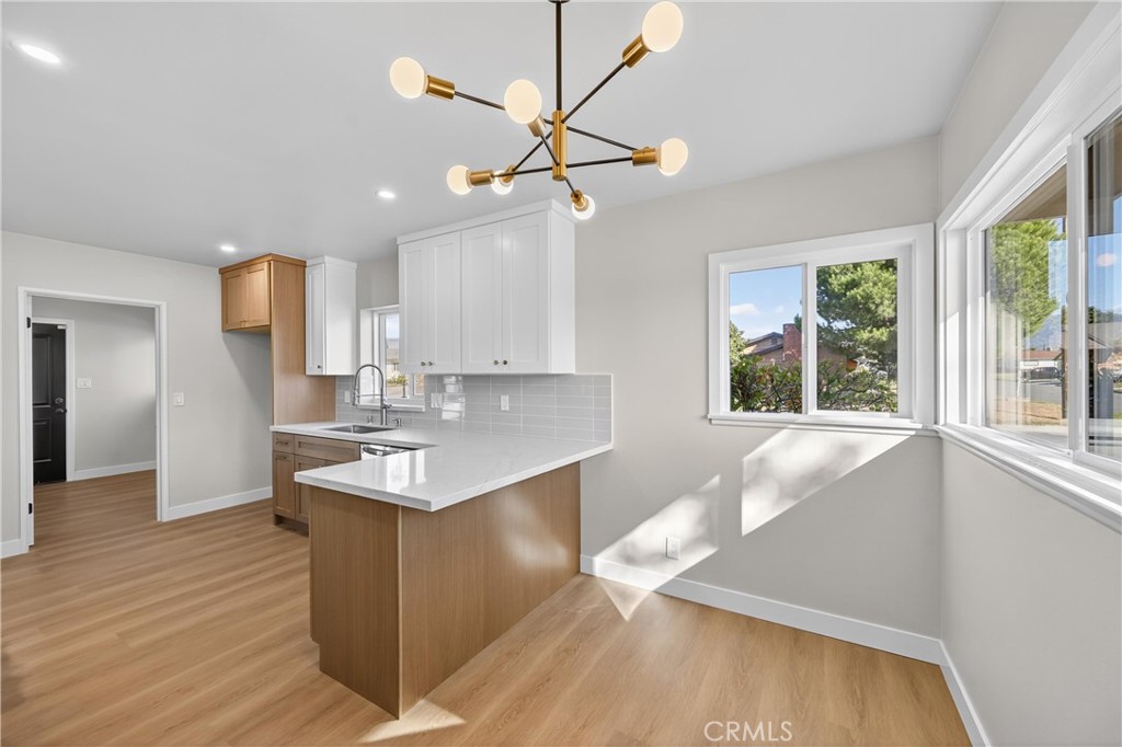 942 North Encina Avenue Rialto, CA 92376 - Photo 12 of 49 a kitchen with a sink cabinets and window