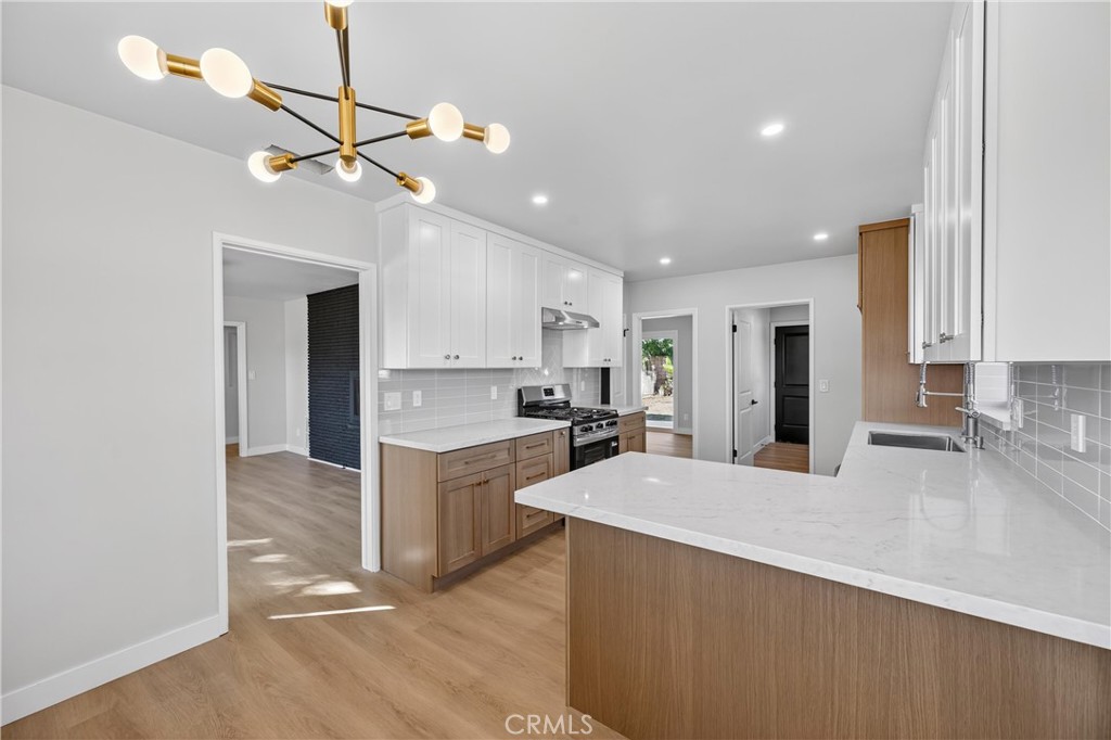 942 North Encina Avenue Rialto, CA 92376 - Photo 13 of 49 a large kitchen with cabinets a sink and appliances