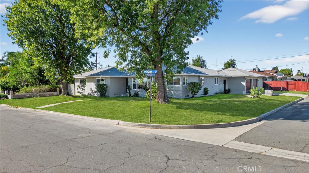 942 North Encina Avenue Rialto, CA 92376 - Photo 2 of 49 a front view of a house with a yard
