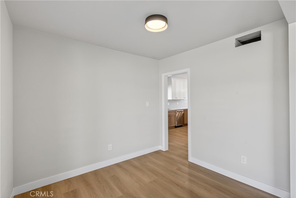 942 North Encina Avenue Rialto, CA 92376 - Photo 27 of 49 a view of an empty room with wooden floor