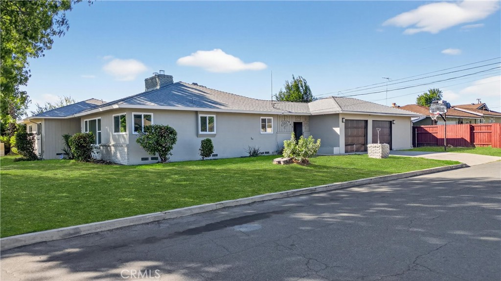 942 North Encina Avenue Rialto, CA 92376 - Photo 3 of 49 a front view of house with yard and green space