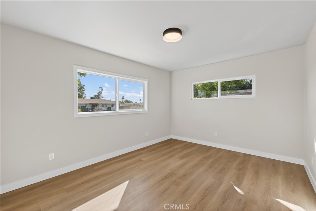 942 North Encina Avenue Rialto, CA 92376 - Photo 31 of 49 a view of empty room with wooden floor