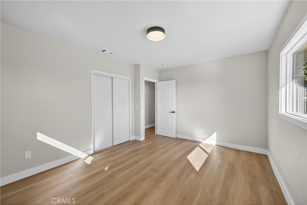 942 North Encina Avenue Rialto, CA 92376 - Photo 33 of 49 a view of empty room with wooden floor and fan