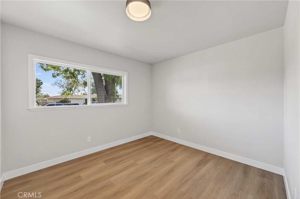 942 North Encina Avenue Rialto, CA 92376 - Photo 34 of 49 a view of empty room with wooden floor