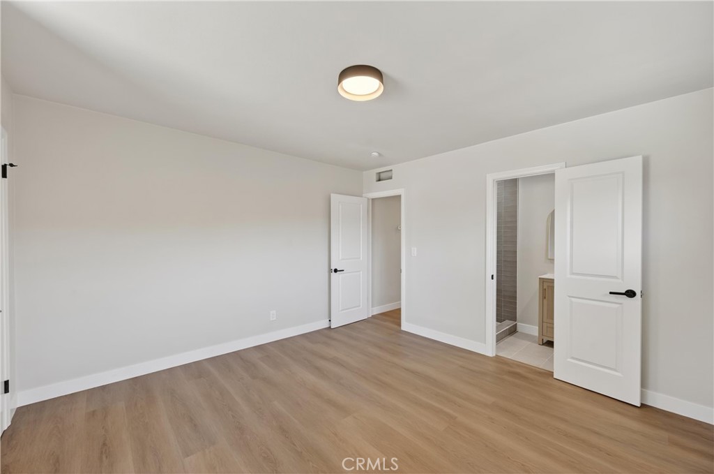 942 North Encina Avenue Rialto, CA 92376 - Photo 39 of 49 a view of an empty room and wooden floor