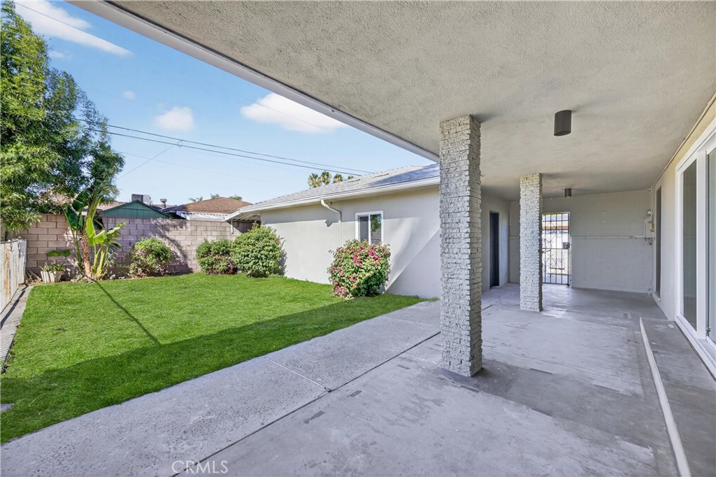 942 North Encina Avenue Rialto, CA 92376 - Photo 44 of 49 a view of a house with a yard and garage